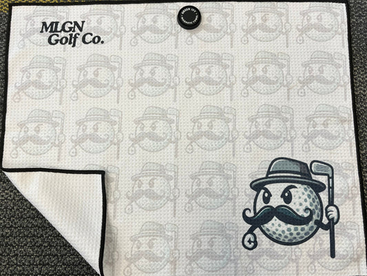 Magnetic white golf towel with MULLY logo featured prominently in bottom right corner, the words MLGN Golf Co. in top left corner, faded MULLY logos as an all over print behind the main logos.
The waffle textured towel has a black stitched outline and a magnet in the top center.