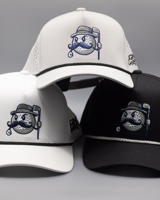 There are three mesh golf hats featured: A white hat with black rope, a black hat with a grey rope, and a grey hat with a black rope. All the hats have the MULLY logo centered on the front crown with the tag MLGN Golf Co. stitched on the right side of the hats.